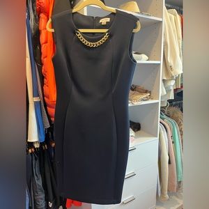 Navy blue dress with gold chain